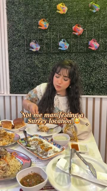 Amna at a table with Khyber dishes in Surrey